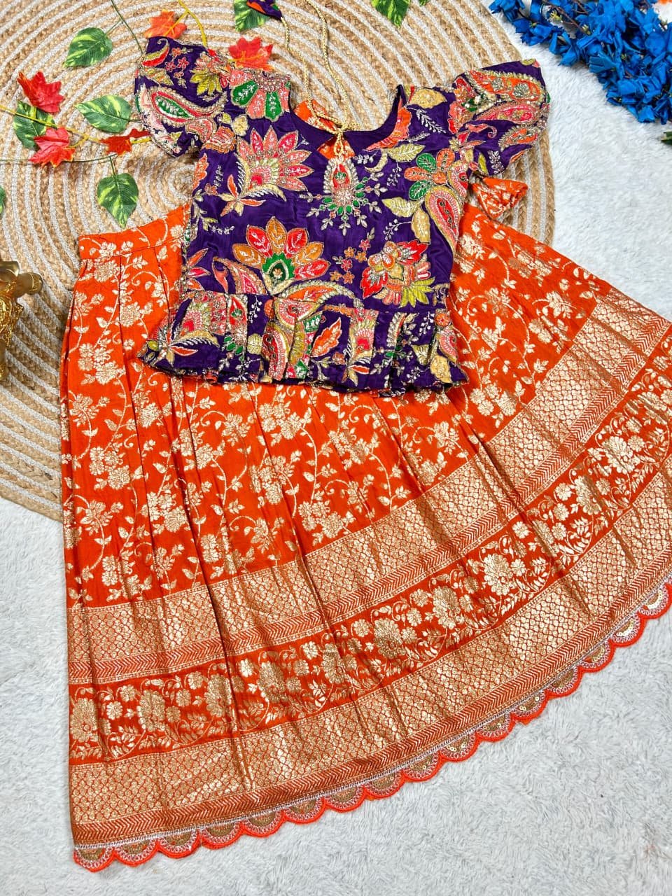 Adorable kids' collection featuring a position print blouse paired with a golden jari work skirt. The outfit combines playful prints with luxurious golden Weaving, perfect for little ones to shine on special occasions. - Image 4