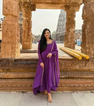 Turn Heads At Weddings And Parties With Our Exquisite Purple Chinnon Silk Anarkali Suit Set. ✨♥️ This Elegant Ensemble Features Intricate Handwork Making You The Star Of The Celebration. Get Ready To Make A Statement! 💃🎉