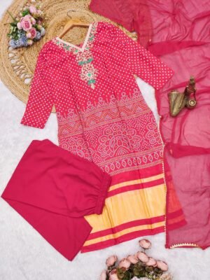 Alternative view of stitched AK launching a beautiful rani pink   And maroon Bandhani-print Salwar Kameez set. It has a very elegant, traditional vibe that works perfectly for festive occasions or semi-formal gatherings.