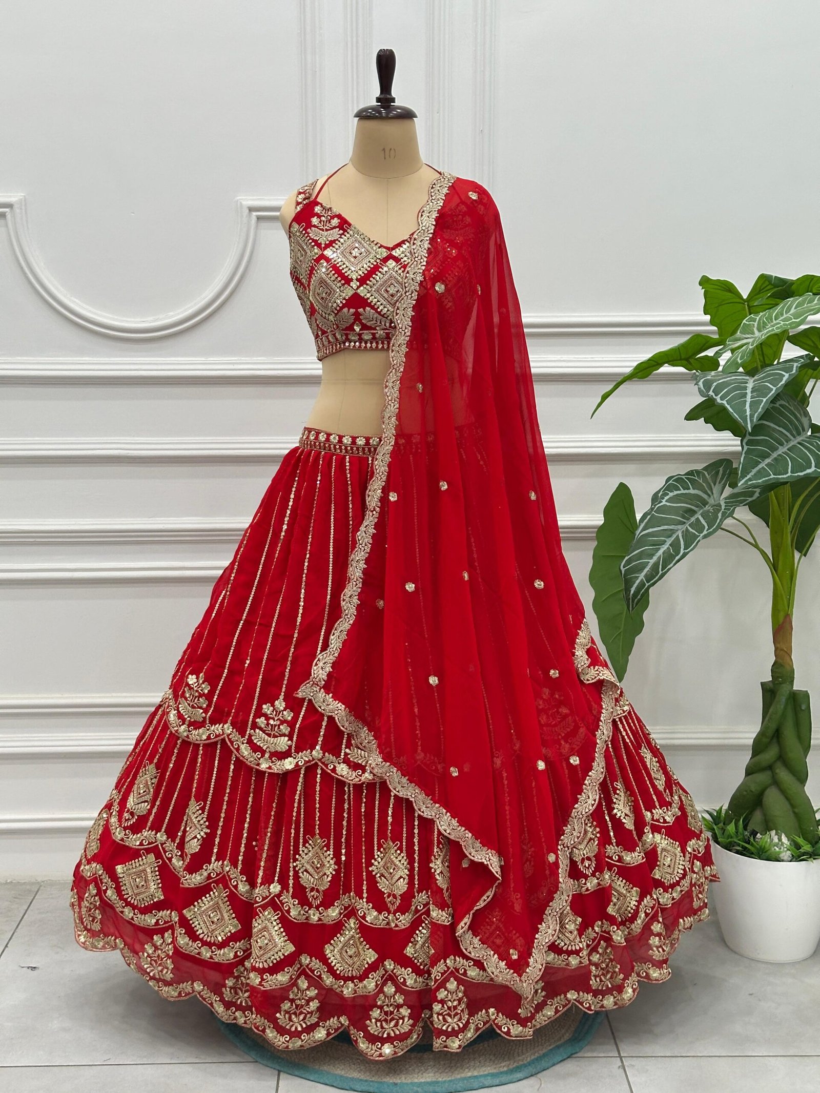 semi stitched Royal red bridal lehenga with heavy embroidery and premium finish - Image 2