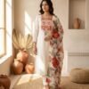 stitched This elegant 3-piece kurta set combines sophisticated craftsmanship with a breezy, floral aesthetic.