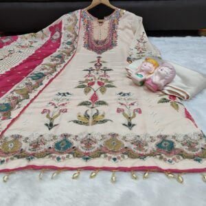 Alternative view of stitched Premium Muslin  Embroidered Suit Set  Elevate your ethnic wardrobe with this exquisite Premium Muslin Silk suit set. Combining a soft peach palette with vibrant traditional detailing, this outfit is designed for those who appreciate elegance and comfort.