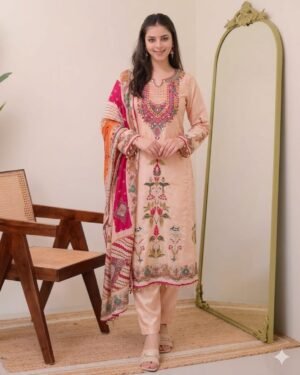 stitched Premium Muslin  Embroidered Suit Set  Elevate your ethnic wardrobe with this exquisite Premium Muslin Silk suit set. Combining a soft peach palette with vibrant traditional detailing, this outfit is designed for those who appreciate elegance and comfort.