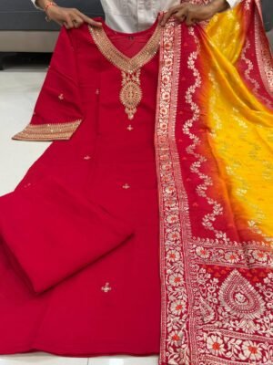 Alternative view of stitched The pure berry berry  silk kurta is adorned with intricate machine embroidery coding across the sleeves and neckline, lending a touch of regal finesse. It is paired with bery bery pants for effortless comfort and a flowing silhouette. Completing the ensemble is a statement pure zari stripe KANJIVARAM Silk  dupatta, beautifully dyed to perfection, adding grandeur and festive charm