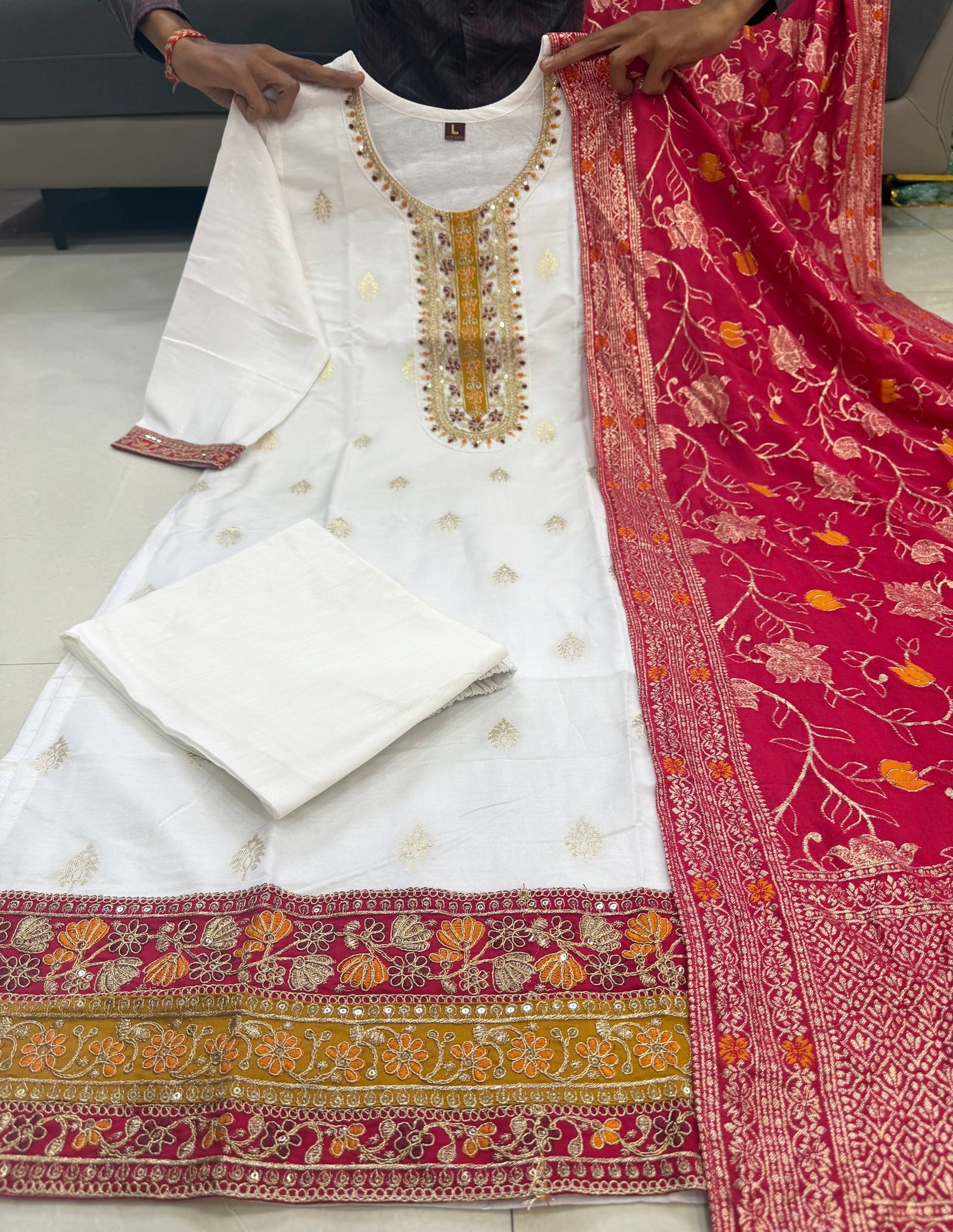 The pure Kanjivaram Silks 🪷 kurta is adorned with intricate machine embroidery coding across the sleeves and neckline, lending a touch of regal finesse. It is paired with very comfortable pants for effortless wear and a flowing silhouette. Completing the ensemble is a statement pure zari stripe Kanjivaram Silk dupatta, beautifully dyed to perfection, adding grandeur and festive charm. - Image 2