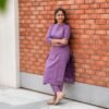 Simplicity That Speaks Elegance!  Turn heads with this soothing lavender cotton kurti with matching pant set, crafted for comfort and style. Featuring a straight fit with subtle polka detailing, 3/4th sleeves, and a classy mandarin collar, this outfit is perfect for office wear, casual outings, or festive occasions. Pair it with minimal accessories for that effortless, graceful look!