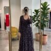 This is a feminine, daytime maxi dress featuring an all-over delicate floral print. A flowing, three-tiered gathered flare that adds volume, movement, and a bohemian  aesthetic to the lower half. The standout detail  is this beautiful layer jacket (SHRUG) Can be styled any ways