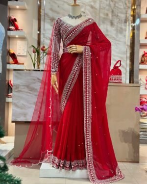 Fall in love with this stunning saree in an eye-catching shade, crafted with finesse and rich detailing. A perfect blend of grace and glam For Karwa Chauth.