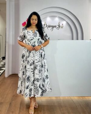 This beautiful dress features a delicate  hue adorned with a captivating floral print, it ensures comfort while keeping you stylish all day long