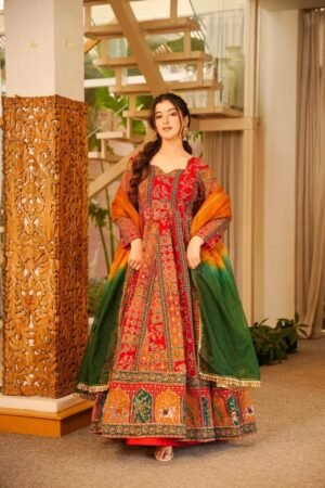 This is a stunning and festive Chinon fabric gown featuring a traditional Patola print, making it an absolute masterpiece for weddings, festivals, and special occasions.