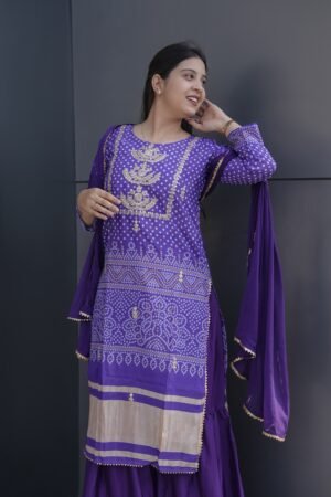 This is a beautiful and elegant Chinon Kurta Set in a rich purple hue