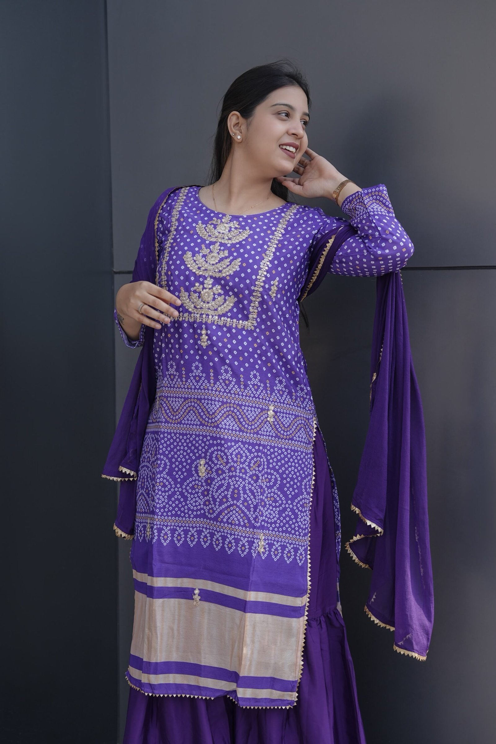 This is a beautiful and elegant Chinon Kurta Set in a rich purple hue