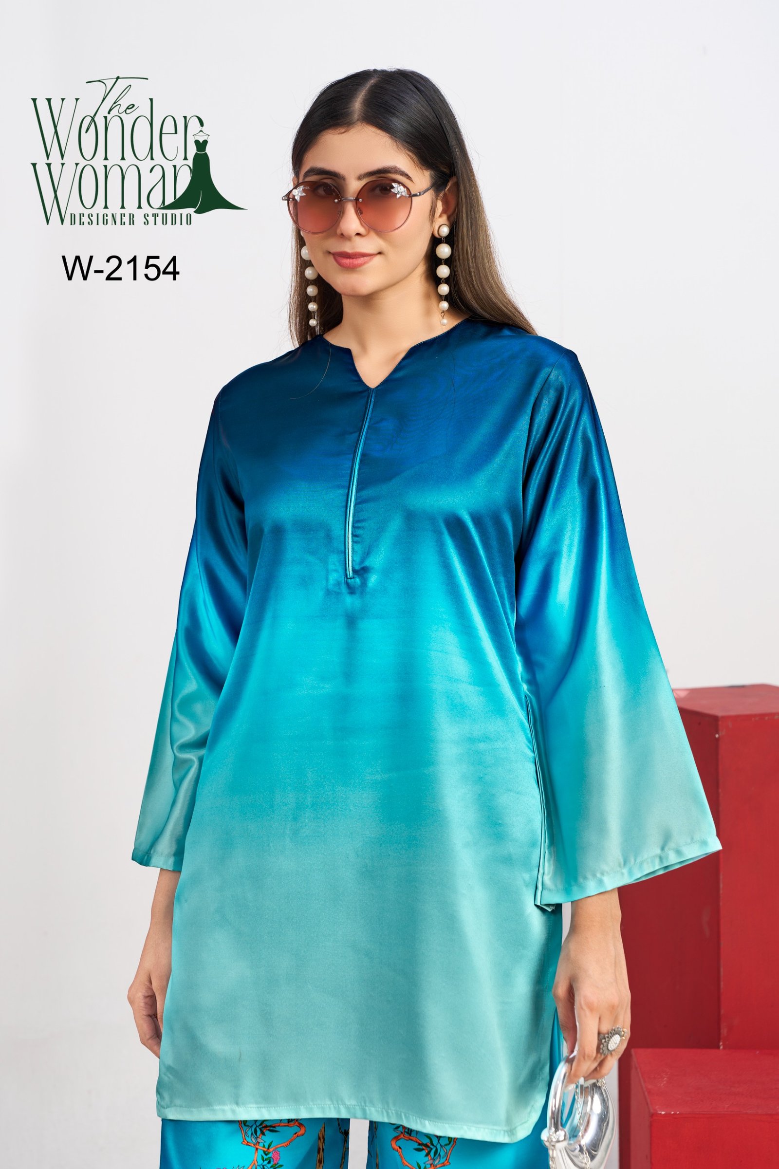 This satin teal kurta paired with statement floral bottoms is all about grace with a touch of bold. Perfect blend of comfort and style - Image 2