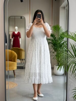 The dress features a smocked bodice,