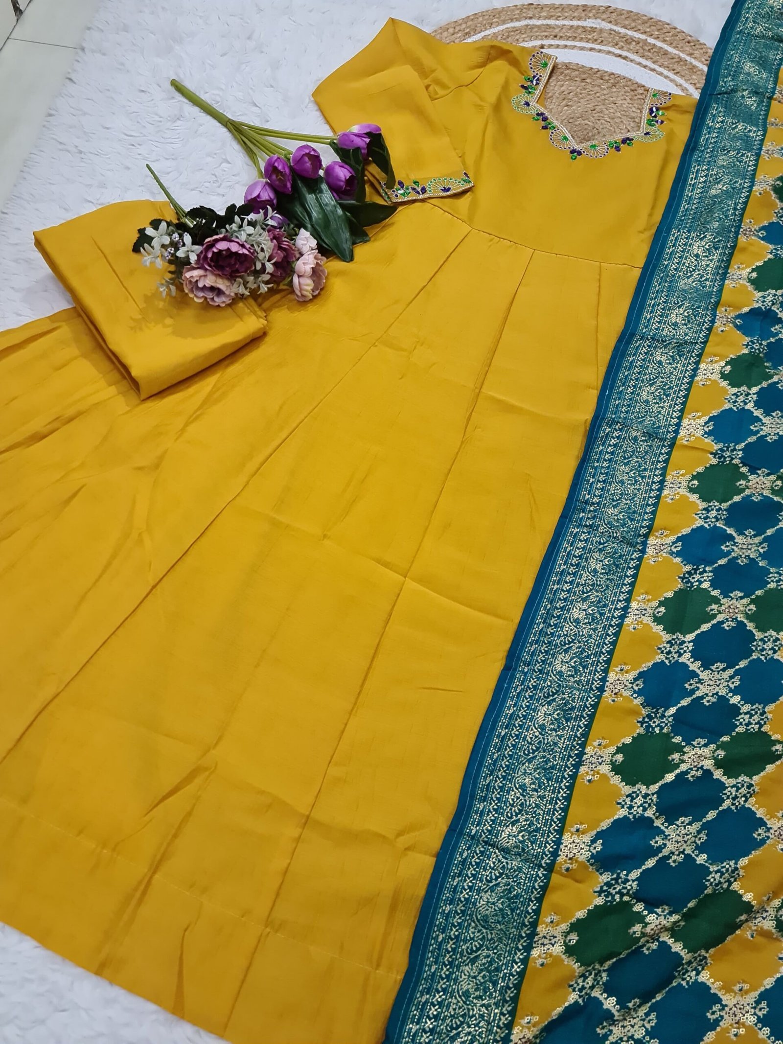 he Tensemble presents a vibrant and traditional look, suitable for festive occasions or cultural events.