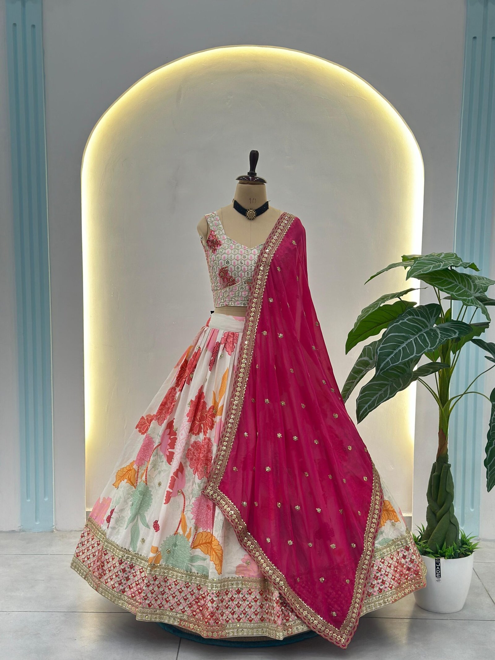 This floral white lehenga choli with a vibrant pink dupatta is the perfect blend of elegance and festive charm - Image 2