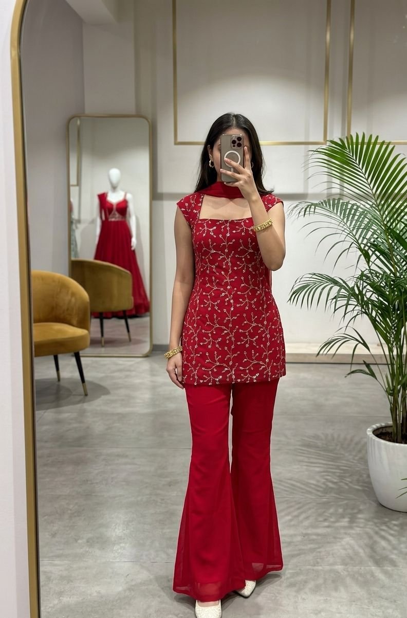 This vibrant red 3-piece co-ord set, effortlessly blends contemporary flair with timeless elegance through its delicate floral embroidery and modern square neckline.