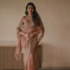 Fall in love with this stunning saree in an eye-catching shade, crafted with finesse and rich detailing.