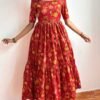 Introducing our latest  essential: the Red Floral Dress. Crafted for comfort, this easy-breezy dress features a delightful  floral print. With a charming back knot detail and playful frill at the bottom, it’s perfect for sunny days. 