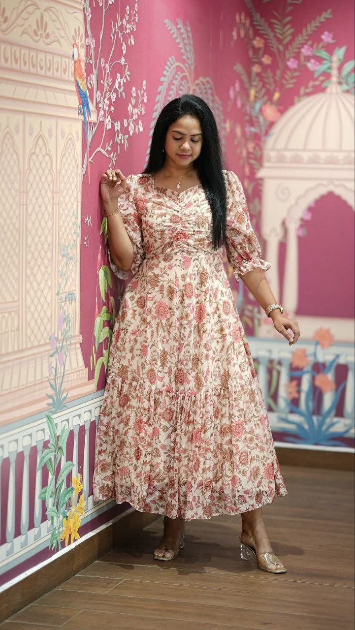 Introducing our latest essential: the Floral Dresses. Crafted for comfort, this easy-breezy dress features a delightful floral print. With a charming neck detail and playful frill at the bottom, it’s perfect for sunny days. - Image 3