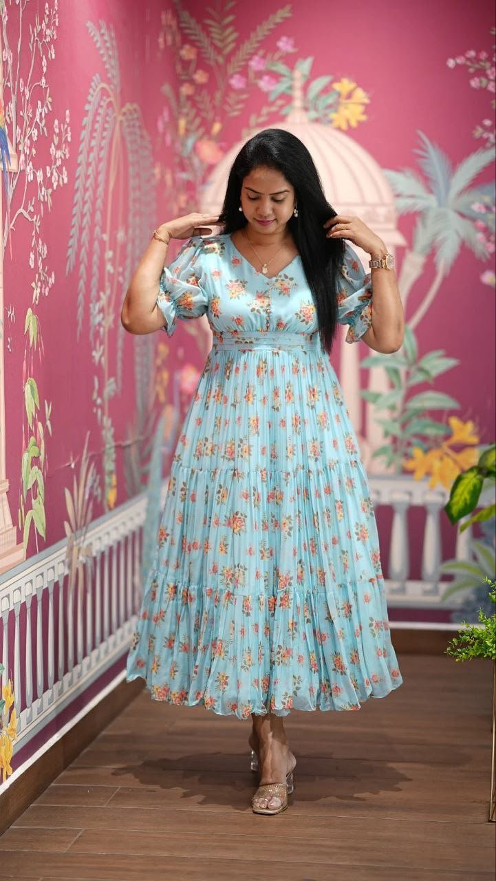 Introducing our latest essential: the Floral Dresses. Crafted for comfort, this easy-breezy dress features a delightful floral print. With a charming neck detail and playful frill at the bottom, it’s perfect for sunny days.