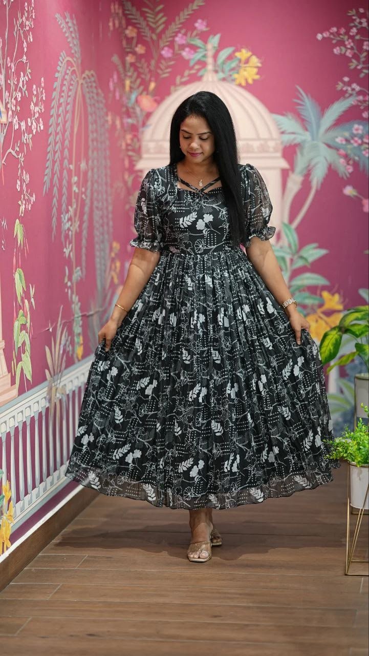 Introducing our latest essential: the Floral Dresses. Crafted for comfort, this easy-breezy dress features a delightful floral print. With a charming neck detail and playful frill at the bottom, it’s perfect for sunny days. - Image 4