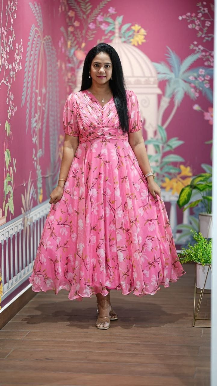 Introducing our latest essential: the Floral Dresses. Crafted for comfort, this easy-breezy dress features a delightful floral print. With a charming neck detail and playful frill at the bottom, it’s perfect for sunny days. - Image 2
