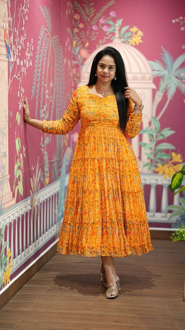 Introducing our latest essential: the Floral Dresses. Crafted for comfort, this easy-breezy dress features a delightful floral print. With a charming neck detail and playful frill at the bottom, it’s perfect for sunny days. - Image 6