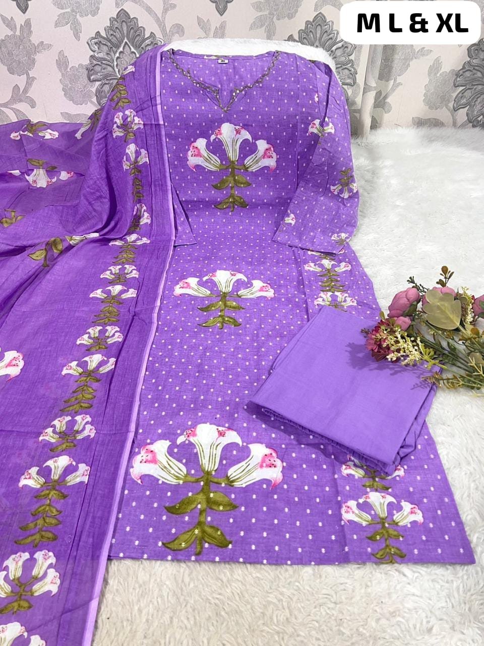 Featuring a beautifully floral printed Cotton kurta with subtle hand embroidery on the neckline, it’s paired with a matching printed mal cotton dupatta and comfortable solid cotton pants. - Image 2