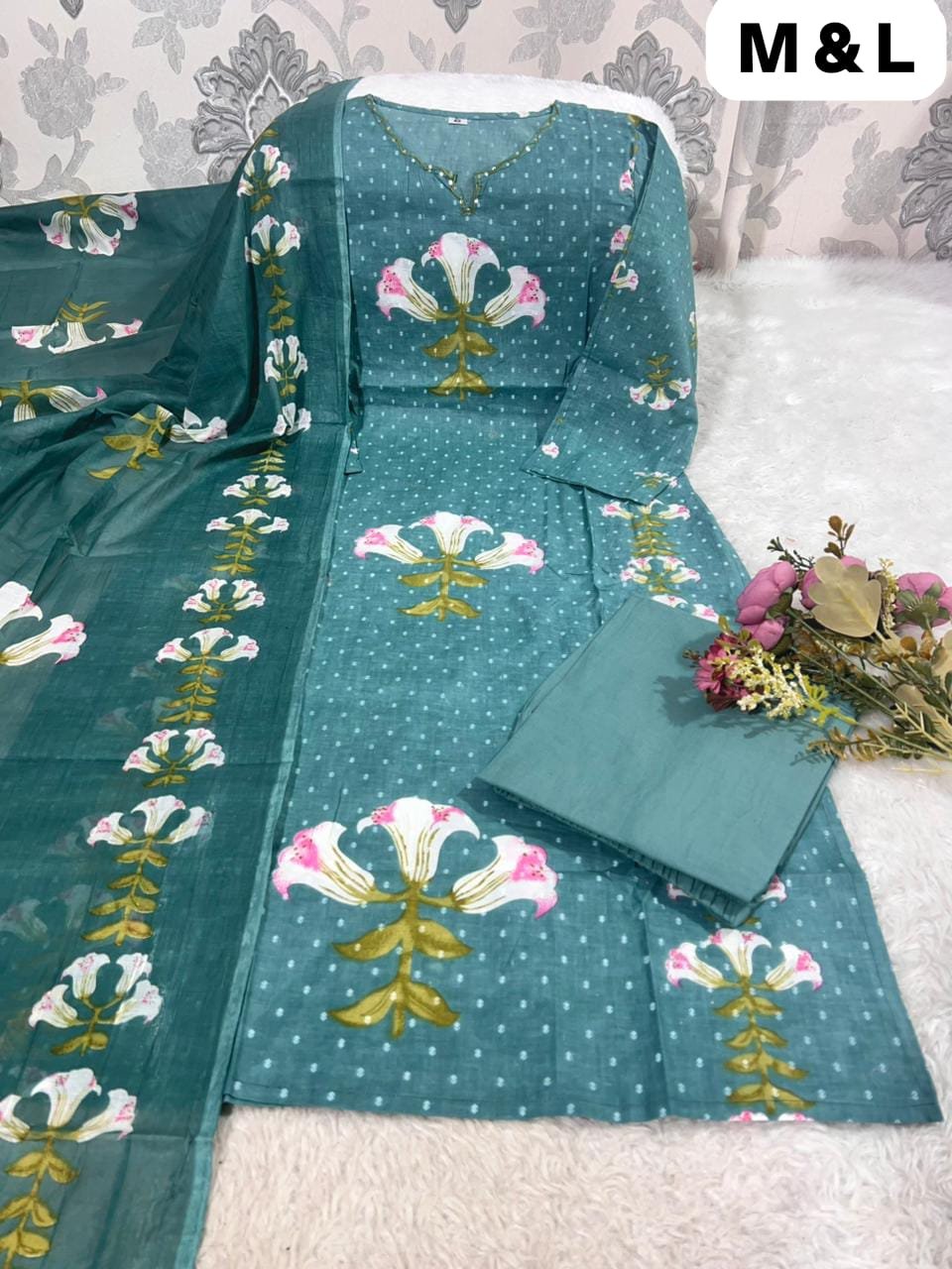 Featuring a beautifully floral printed Cotton kurta with subtle hand embroidery on the neckline, it’s paired with a matching printed mal cotton dupatta and comfortable solid cotton pants. - Image 4