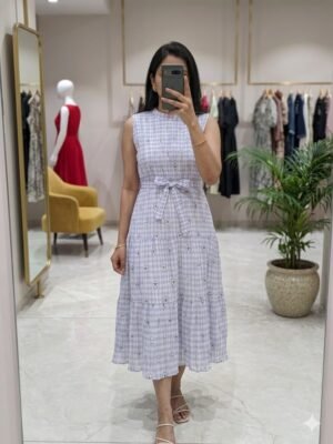 The flare is divided into multiple horizontal tiers, adding a subtle "boho-chic" volume that flows well while walking.