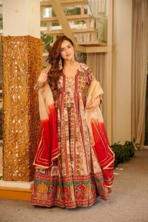 Introducing a stunning heavy golden thered works with original mirror works maxi set paired with a graceful dupatta, crafted for timeless elegance