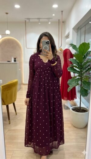 Stay Effortlessly Beautiful In Our  Emb Anarkali A Perfectly Enhanced With Wine & Golden Thread Sequence Work All Over The Gown The Outfit Comes Paired With A  Dupatta With CutWork broach