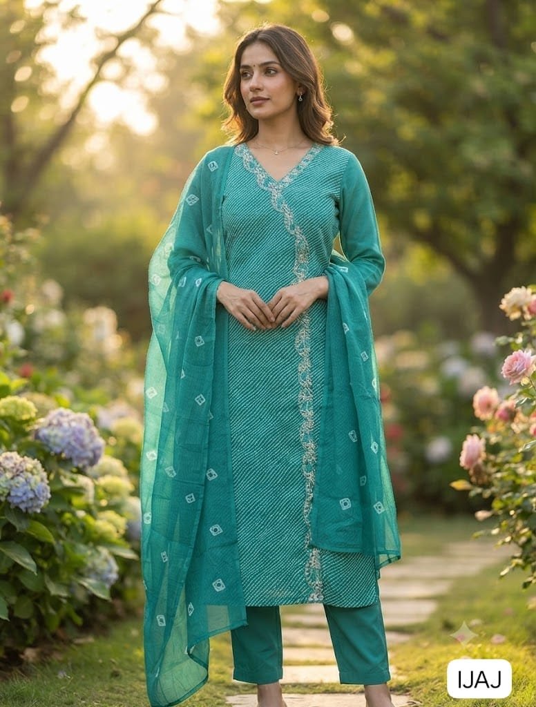 Get ready to look stunning this festive season with our beautiful, traditional Lehriya & Bandhani Dress Material Set