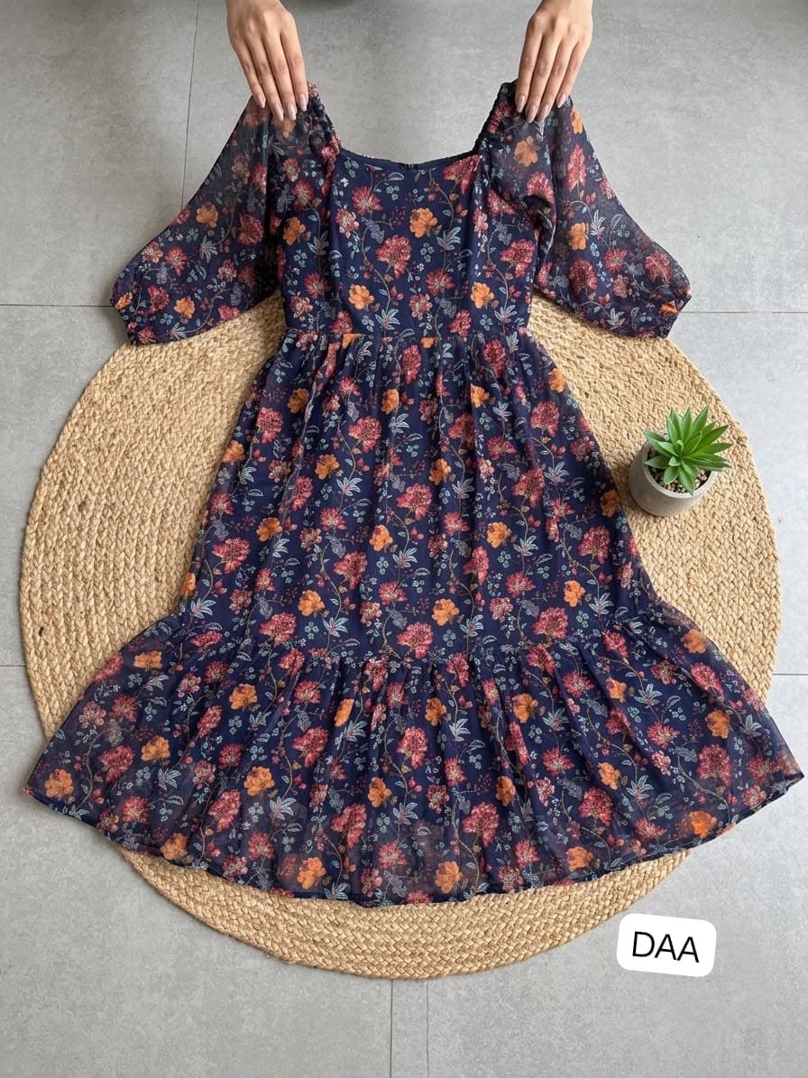 These dresses capture"s a lovely "boho-chic" aesthetic, blending a romantic silhouette with beautiful print A midi-length tea dress with a feminine, flowy silhouette. - Image 2