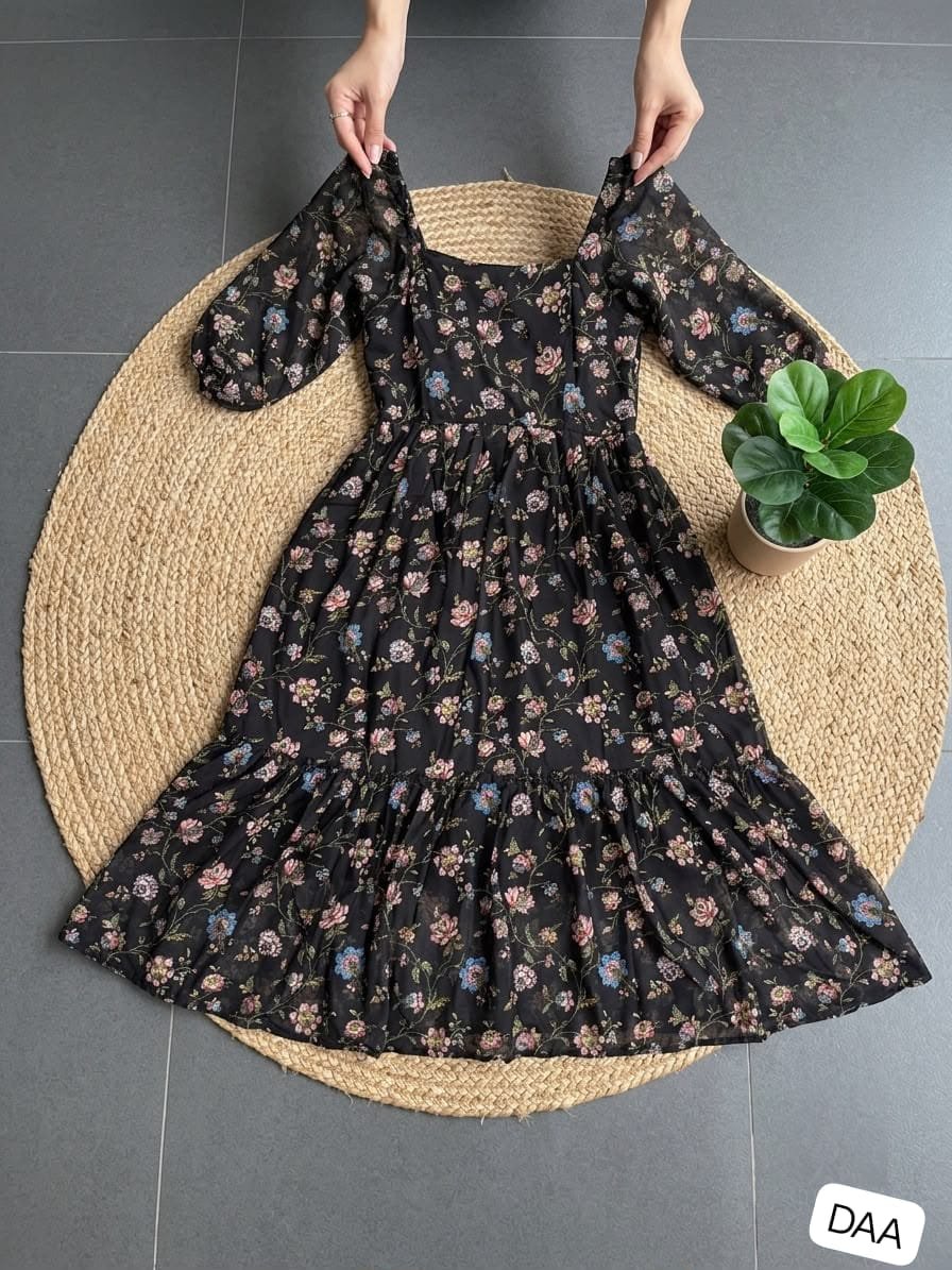 These dresses capture"s a lovely "boho-chic" aesthetic, blending a romantic silhouette with beautiful print A midi-length tea dress with a feminine, flowy silhouette. - Image 4