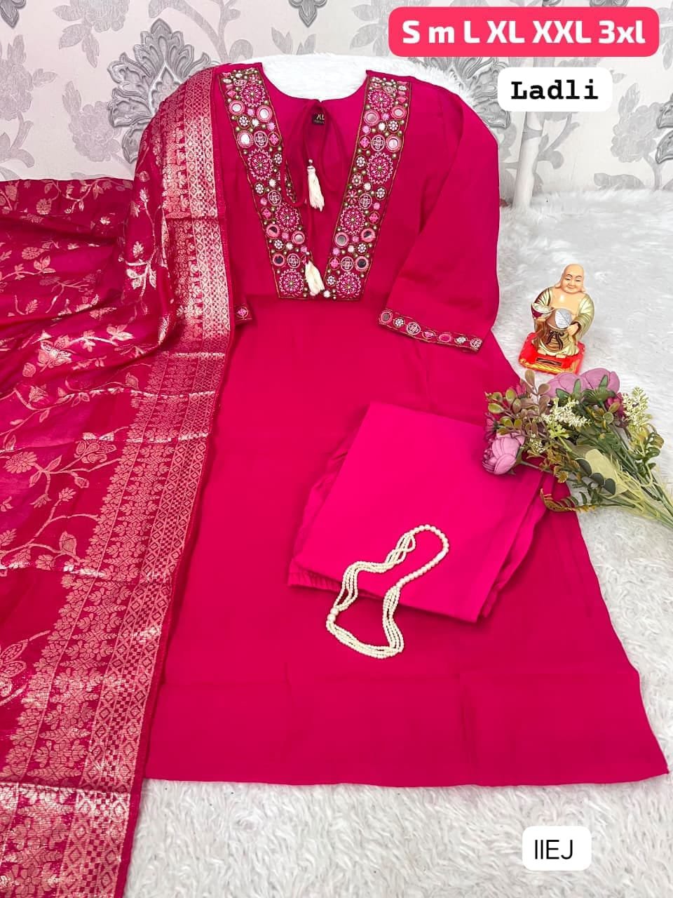 Add grace and elegance to your wardrobe with the beautiful LADLI designer suit set