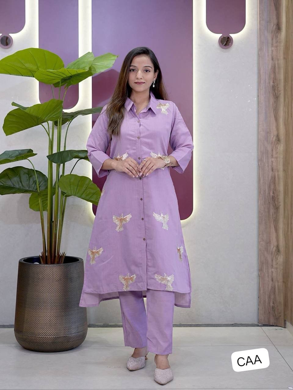 Step into timeless elegance with this beautifully crafted 2 piece suit set featuring a roman Silk Kurti, matching Palazzo,