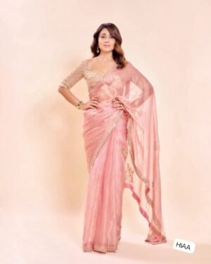 Fall in love with this stunning saree in an eye-catching shade, crafted with finesse and rich detailing. A perfect blend of grace and glam!