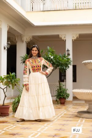 Celebrate the festive spirit in this beautifully fully flared Navratri gown, crafted from soft rayon or cotton fabric