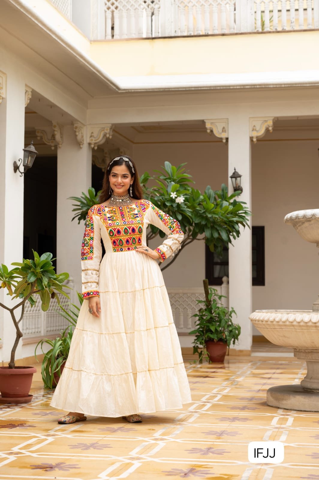 Celebrate the festive spirit in this beautifully fully flared Navratri gown, crafted from soft rayon or cotton fabric