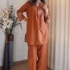 This pure cotton fabric co-ord features a chic pleated top with delicate sleeves, paired with comfy palazzo pants adorned with  Embroidery Work detailing