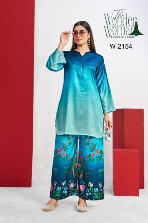 This satin teal kurta paired with statement floral bottoms is all about grace with a touch of bold. Perfect blend of comfort and style