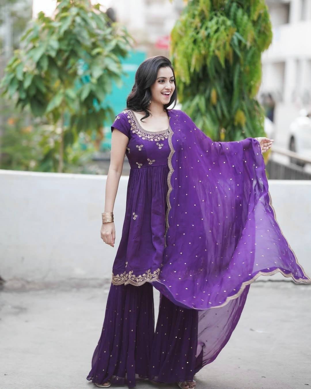 Drape yourself in elegance with this Kediya style Chinon Silk Sharara set paired with a dreamy Georgette dupatta