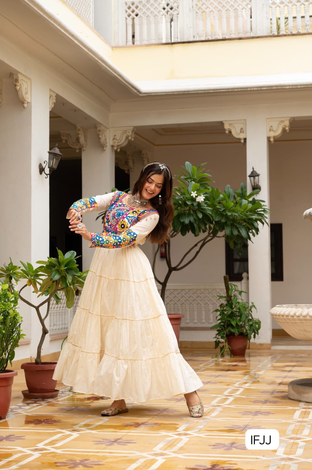 Celebrate the festive spirit in this beautifully fully flared Navratri gown, crafted from soft rayon or cotton fabric.