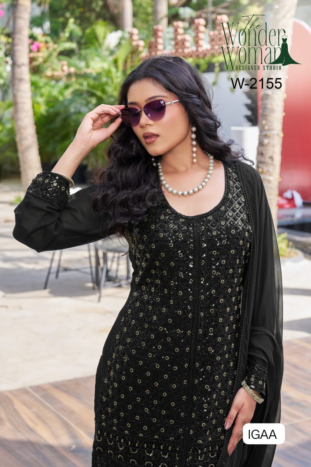 W-2155 Intricately detailed with heavy beads work and finished with a rich lace daman, this outfit is all about understated glamour. - Image 2